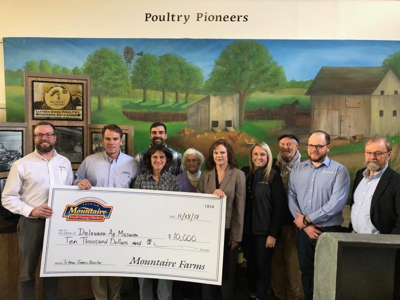 Mountaire Farms presents a $10,000 check to the Delaware Ag Museum to help fund a poultry exhibit overhaul and honor the life of the late James Baxter. Shown are (l-r) Adam Downes, director of agribusiness, Lee Sproull, grain merchandising manager, granddaughter Kristy Baxter Malin, grandson Jay Baxter, wife Ruth Baxter, museum Director Carolyn Claypoole, museum trustee Samantha Steele, museum board President Grier Stayton, museum trustee Cody Petit and trustee J. Everett Moore. SUBMITTED PHOTO